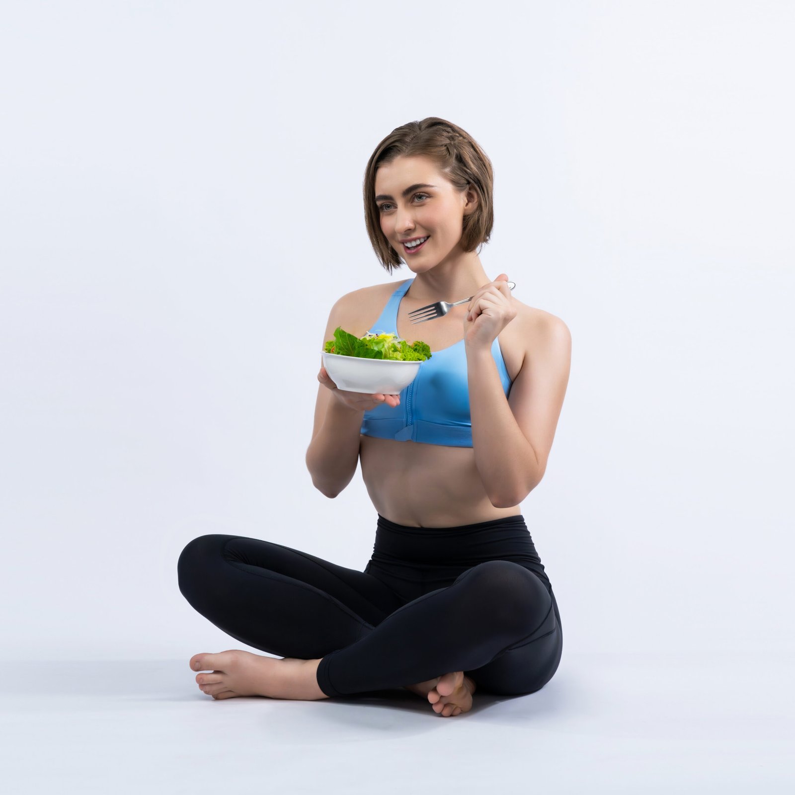 Full body length gaiety shot athletic and sporty young woman with healthy vegan food in standing posture on isolated background. Healthy active and body care by vegetarian lifestyle.